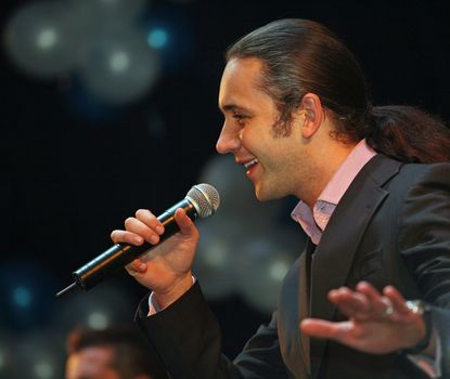 RUSSIA, MOSCOW - 23 DECEMBER: Concert of group Russian group "Dynamite" On a photo the participant of group Ilya Zudin 23 december, 2006 in Moscow