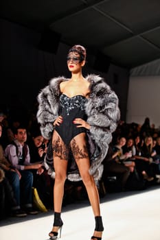 NEW YORK - FEBRUARY 11: Model walks the runway for the  Farah Angsana collections Mercedes-Benz Fashion Week at Lincoln Centre on February 11, 2011 in New York.