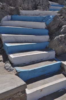 traditional white and blue stairs in a Greek island