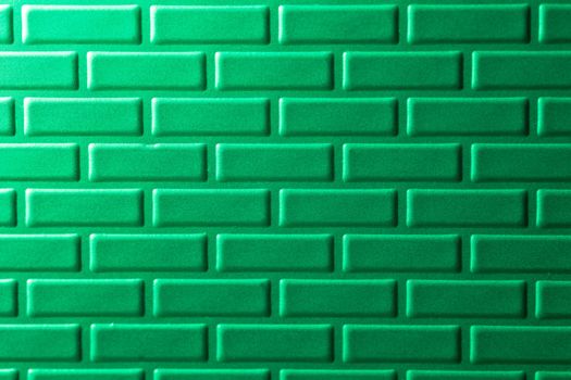 A wall formed by metal bricks