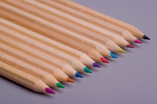A composition of pencils of wood in a variety of colors 