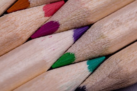 A composition of pencils of wood in a variety of colors 