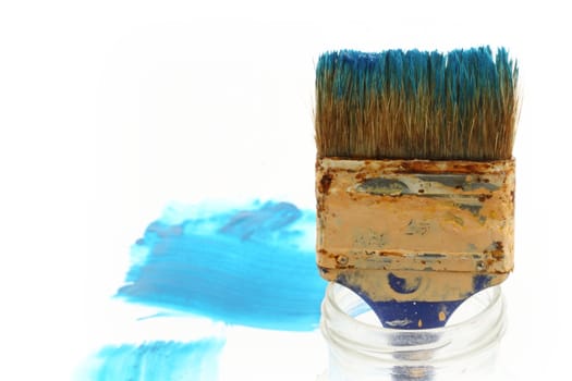 Paintbrush in a glass jar close up