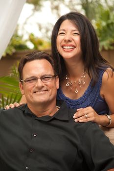 Happy Attractive Hispanic and Caucasian Couple Portrait.