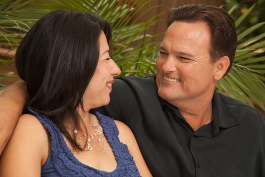 Happy Attractive Hispanic and Caucasian Couple Portrait.