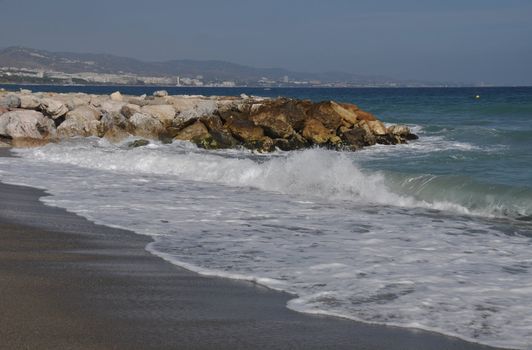 beautiful beach with stone pier in Puerto Banus (Marbella), Spain