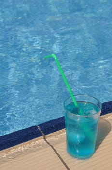 gorgeous blue corazon cocktail at the pool side