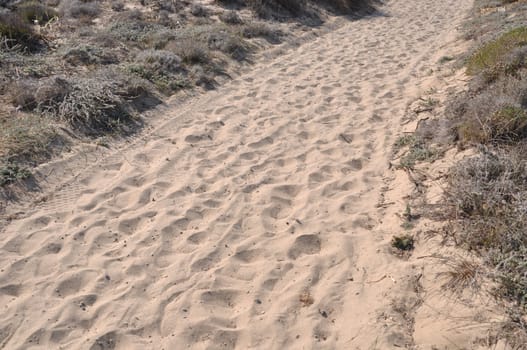 walkway over sand dunes to a beach in Kos island, Greece