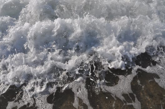 bright ocean water wave as a background or texture