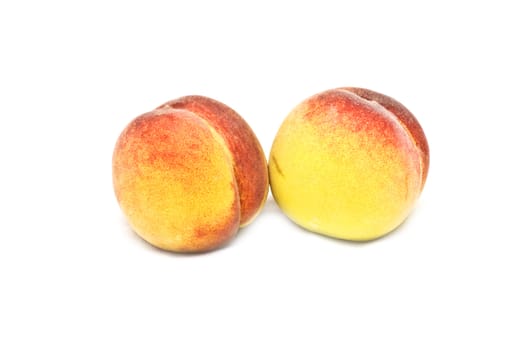 Two isolated peaches