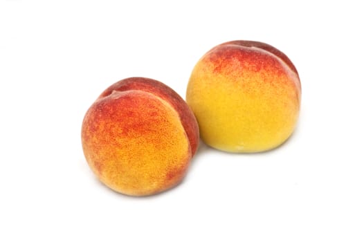 Two isolated peaches