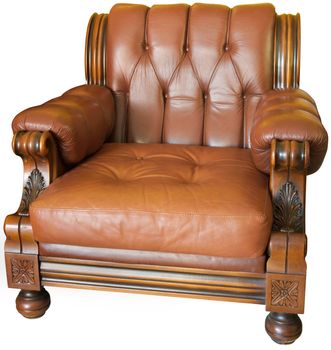 Old wood and leader-made armchair with hand-made woodcarvings, isolated with a clipping path