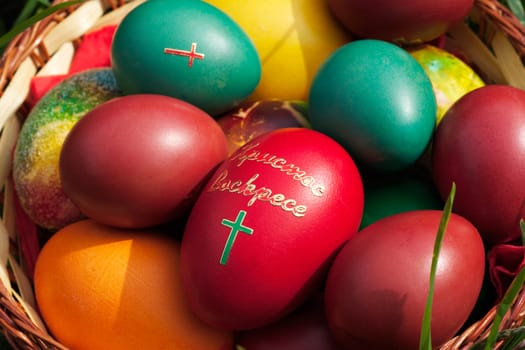 Easter eggs close-up, red egg with cross in the middle