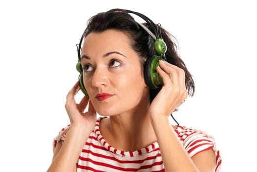 Young woman listening music with headphones isolated on white background