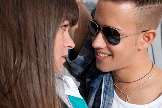 Young couple urban fashion close-up portrait focused on man