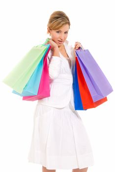 Young woman with shopping bags standing isolated on white background