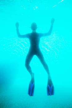 Scuba diver in deep blue water