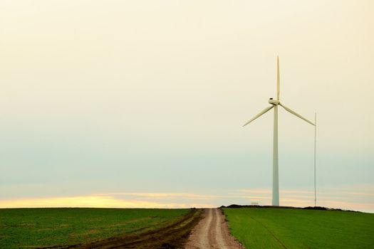 Electricity windmill at sunset