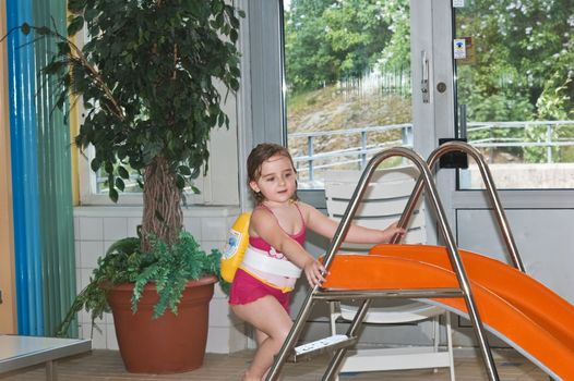 4 years old girl in swimming pool