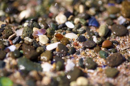 Colorful beach stones at the sea shore