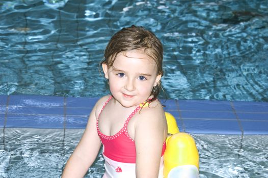4 years old girl in swimming pool