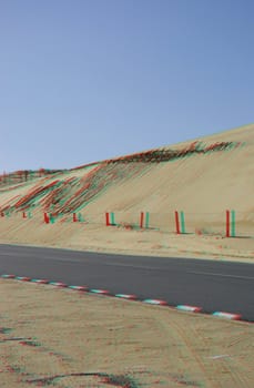 This is an isolated dunes landscape with a little road and with a real stereoscopic effect