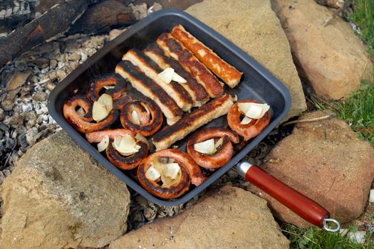 Preparing food on open fire