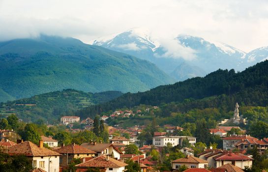 The town of Kalofer with the Botev peak and the memorial of Hristo Botev