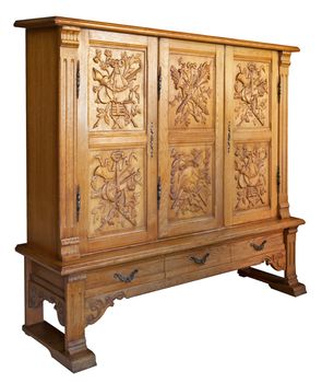 An old classic wooden dresser with hand-made woodcarvings, isolated, with clipping path