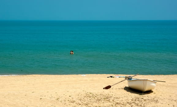 A couple on a Black sea beach taking a bath