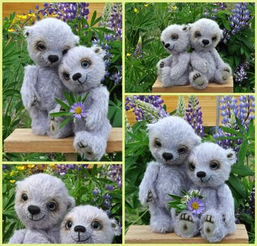 Toys, teddy bear Chupa and its friend Chups among summer flowers. Handmade, sewed from a woollen mohair