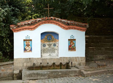 Old fountain with a script in the Bachkovo monastery