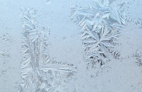 Frosen glass of a window in a cold winter day