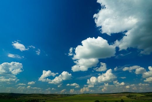 Landscape and deep blue cloudy sky