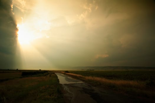 Road to the sunset after the rain