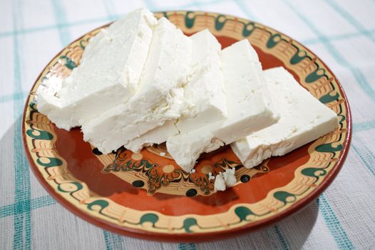 Sliced Bulgarian white feta cheese in a dish