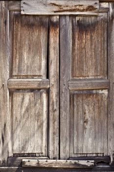 Old door of wooden was closed with grungy style.