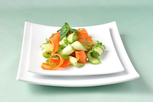 Zucchini salad with carrots and garlic marinade with herbs