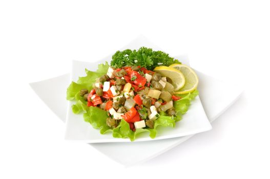 A salad of red peppers with goat cheese, capers, fresh herbs in the marinade