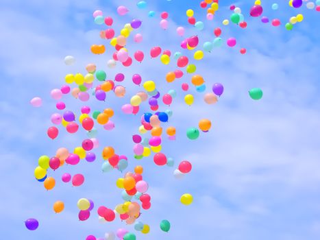 A lot of colorful balloons flying in the sky