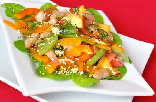  salad vegetables and fruit with chicken and arugula