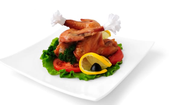 Fried chicken wings with tomato on white background