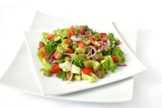 Vegetable salad with capers and herbs close