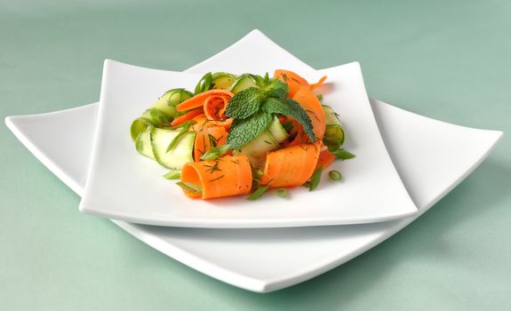 Zucchini salad with carrots and garlic marinade with herbs