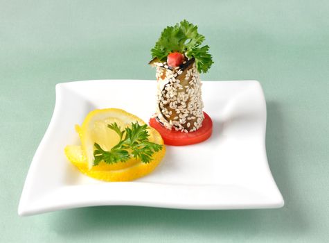  Roulade of eggplant with tomatoes in sesame seeds with lemon and herbs                