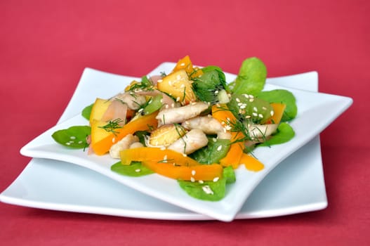 salad vegetables and fruit with chicken and arugula