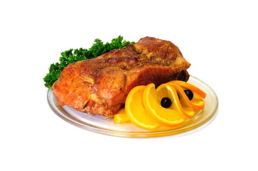 A piece of roasted meat with oranges and olives isolated