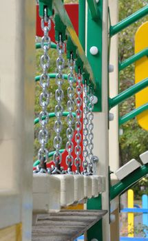 Suspension bridge on the chains (a fragment of the playground to play on the street)
