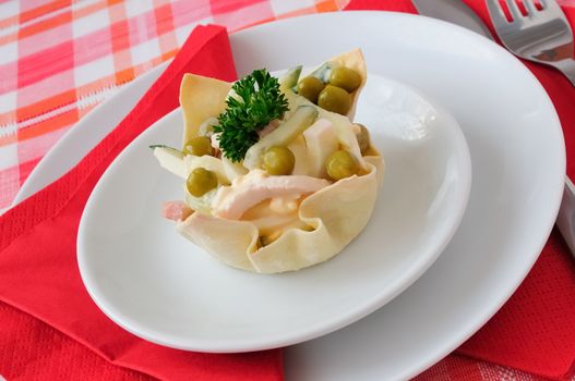 Cucumber salad, eggs, ham, peas, mayonnaise into tartlet (basket)