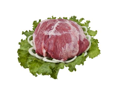 A piece of fresh pork in lettuce leaves with onion